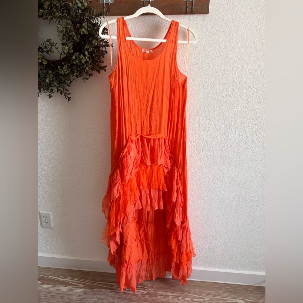 Beautiful orange boutique dress, short front cascading to long ruffling in back